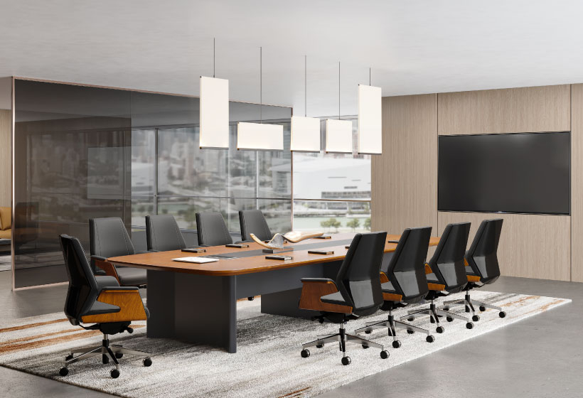 A spacious conference room featuring a large table surrounded by several chairs, suitable for meetings and discussions.