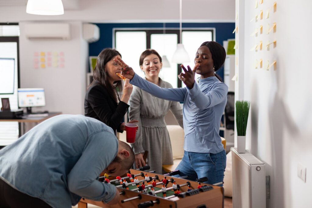 A group of four people enjoying a playful